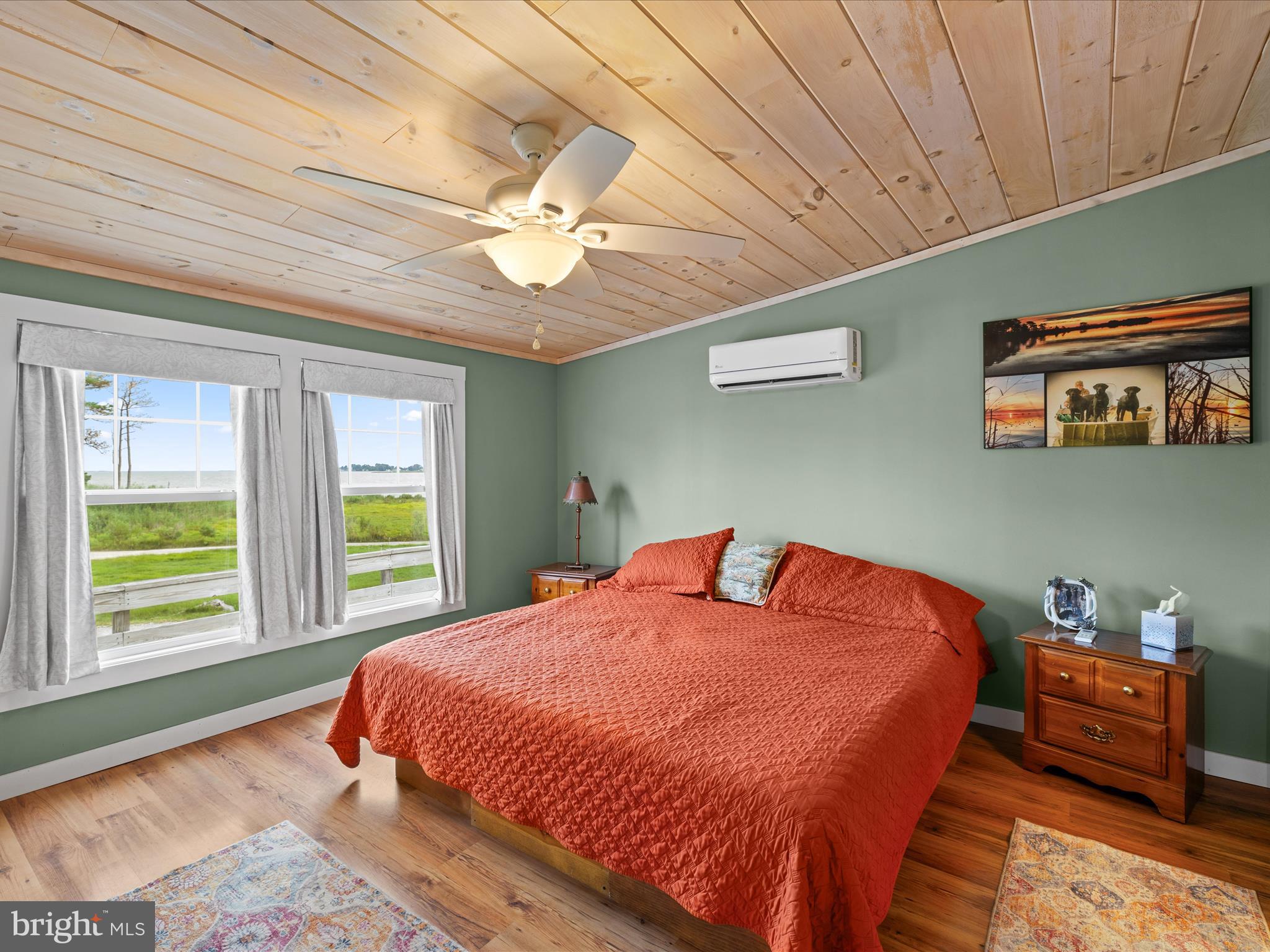 2765 Hoopers Island Road Fishing Creek, MD 21634 - Photo 36 of 111 a bed sitting in a bedroom next to a window