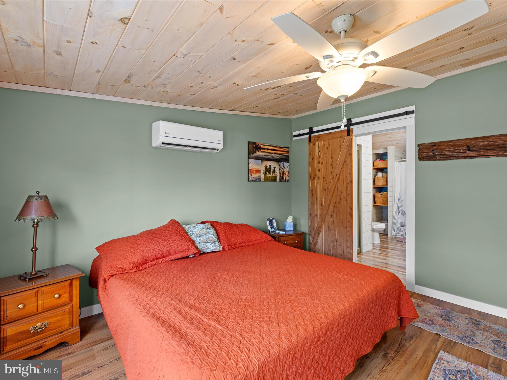 2765 Hoopers Island Road Fishing Creek, MD 21634 - Photo 37 of 111 a bed room with a bed and a chandelier