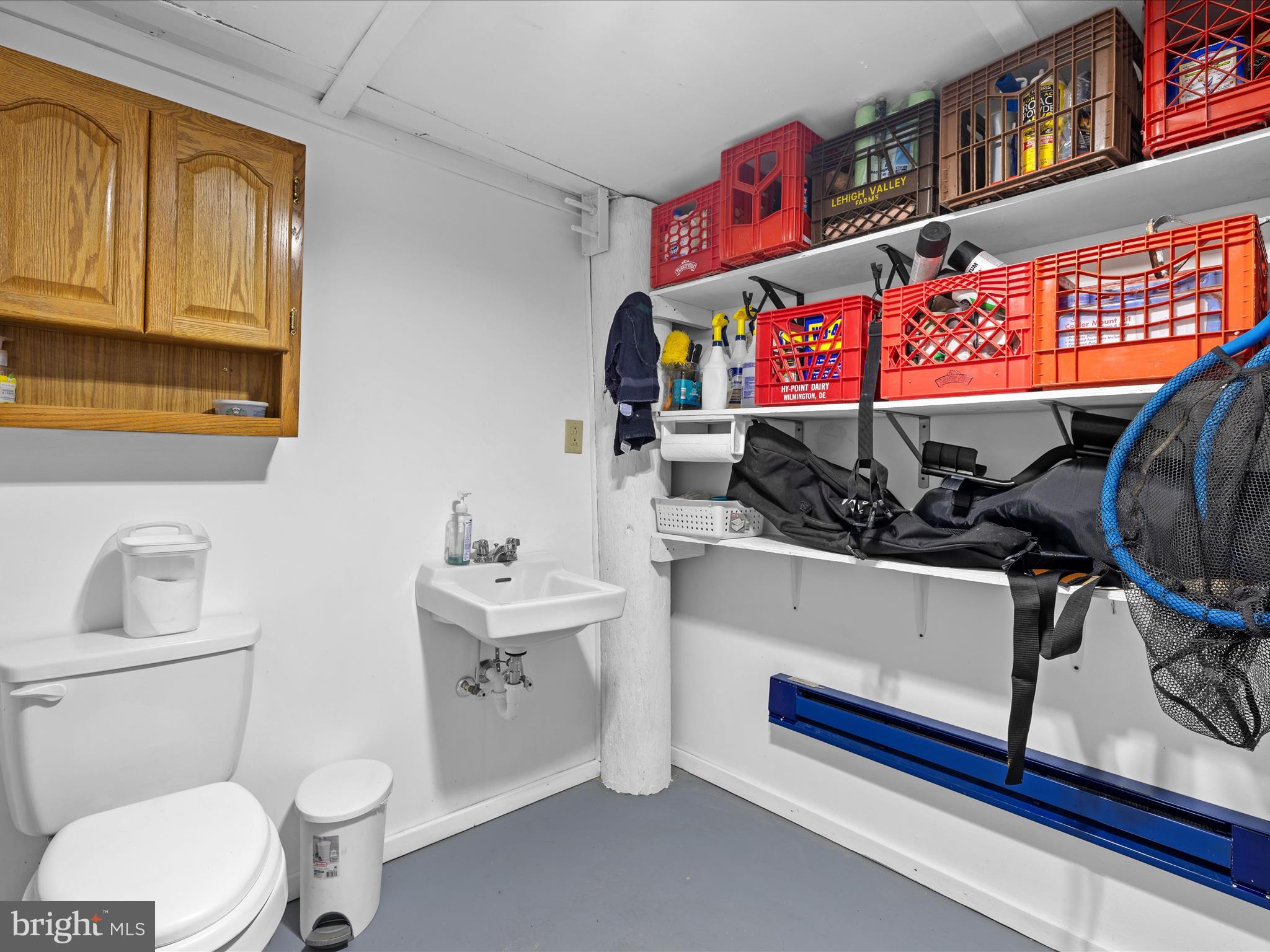 2765 Hoopers Island Road Fishing Creek, MD 21634 - Photo 46 of 111 a bathroom with a sink a toilet and a mirror