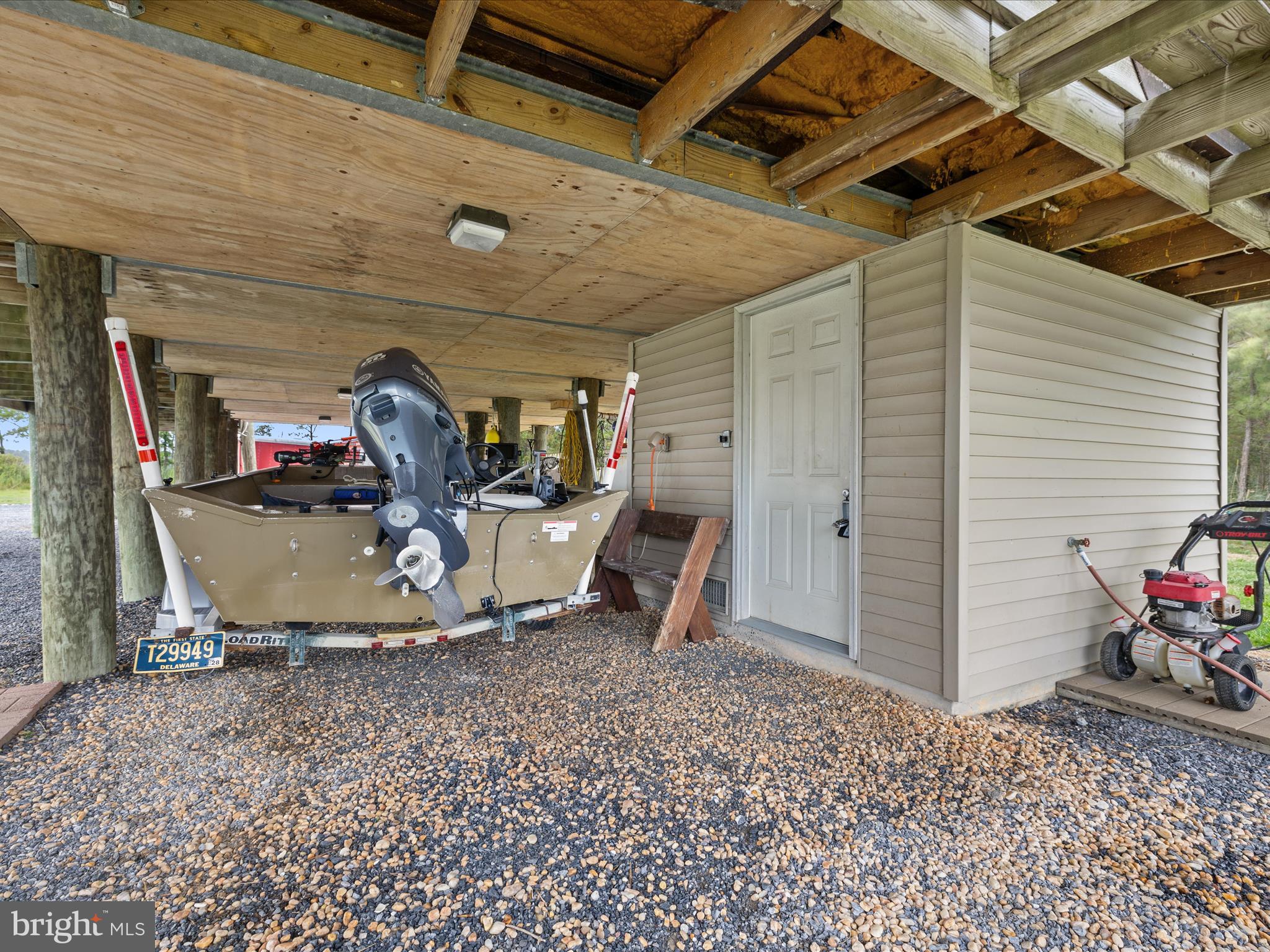 2765 Hoopers Island Road Fishing Creek, MD 21634 - Photo 48 of 111 a view of a garage with a table and chairs