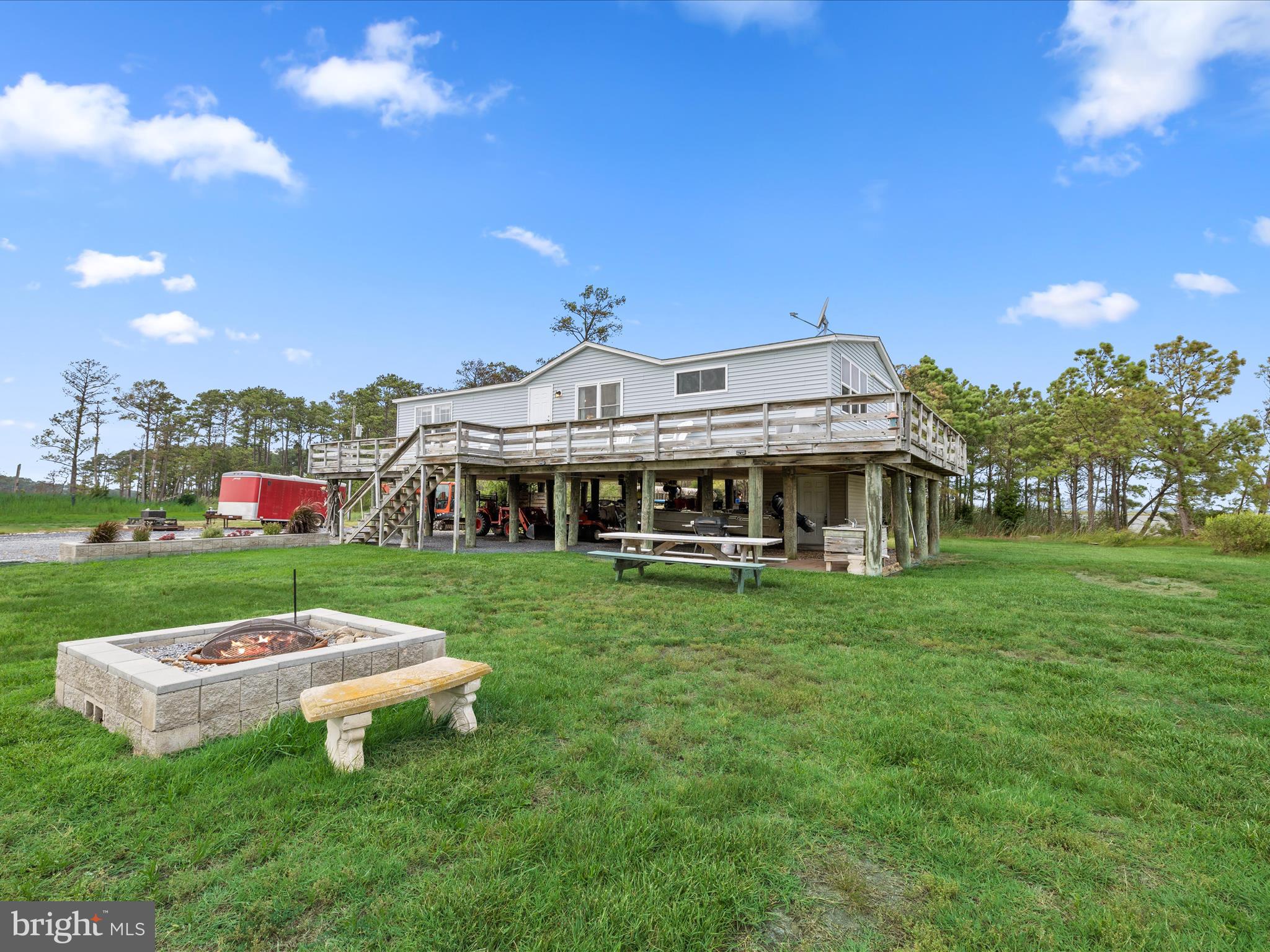 2765 Hoopers Island Road Fishing Creek, MD 21634 - Photo 5 of 111 a front view of a house with garden