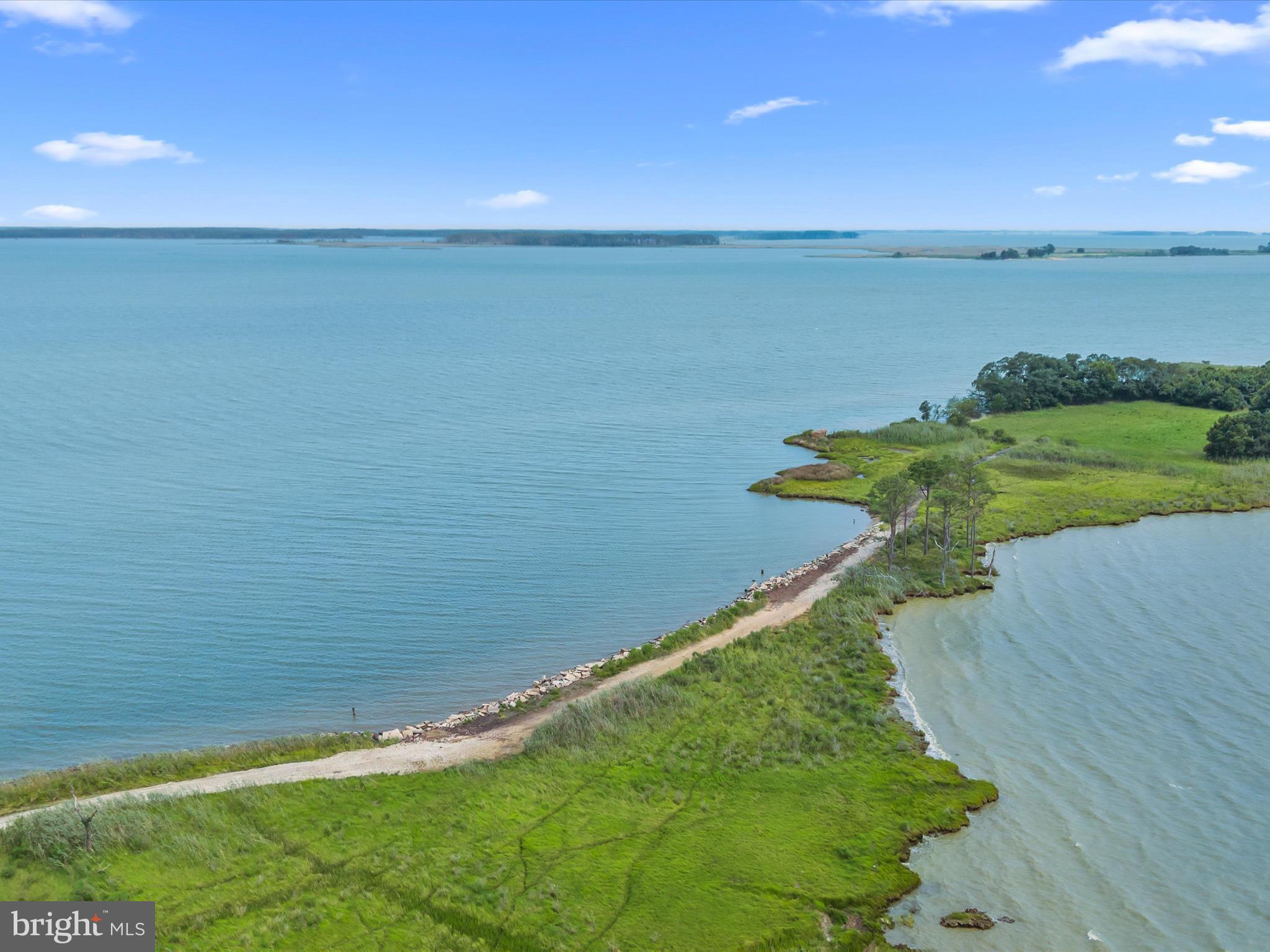 2765 Hoopers Island Road Fishing Creek, MD 21634 - Photo 67 of 111 a view of a lake with a yard
