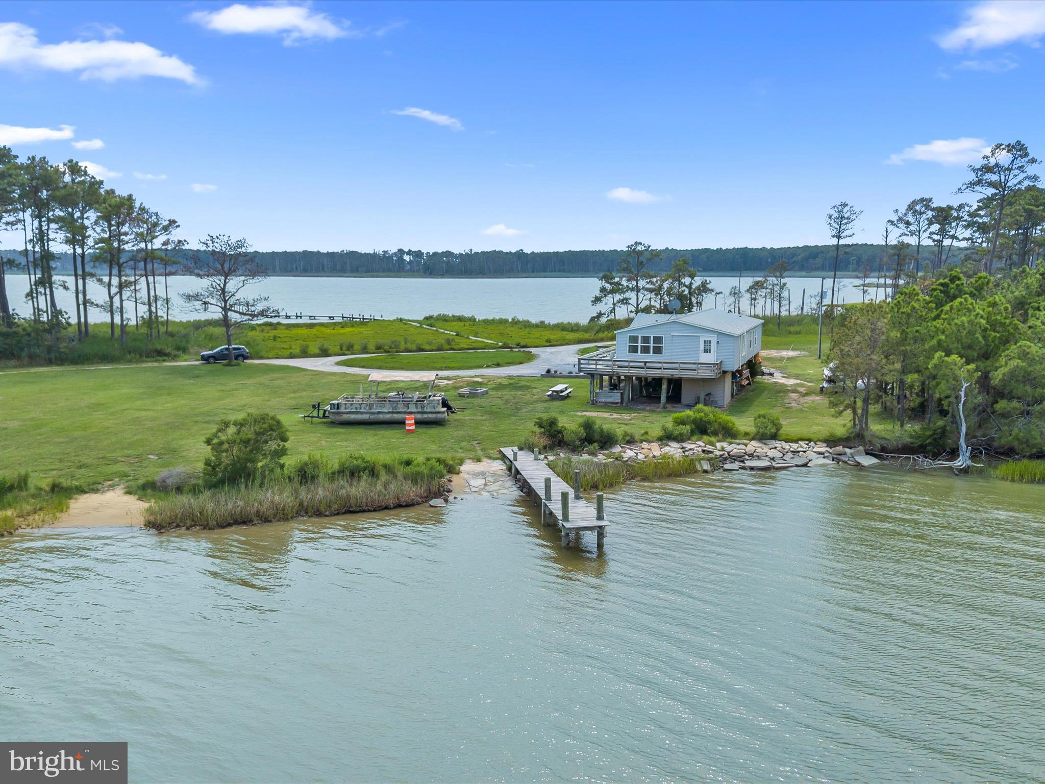 2765 Hoopers Island Road Fishing Creek, MD 21634 - Photo 9 of 111 a view of a lake with a big yard