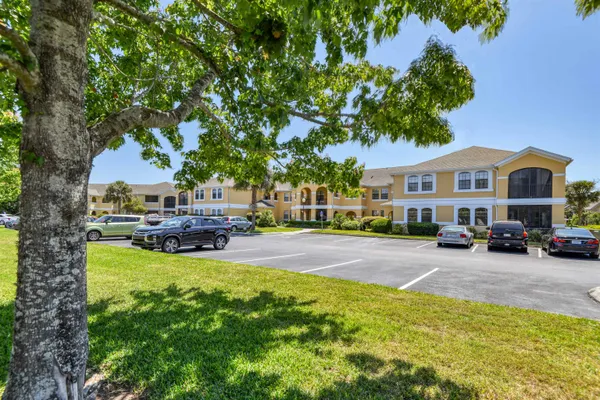 a view of a house with swimming pool and sitting area