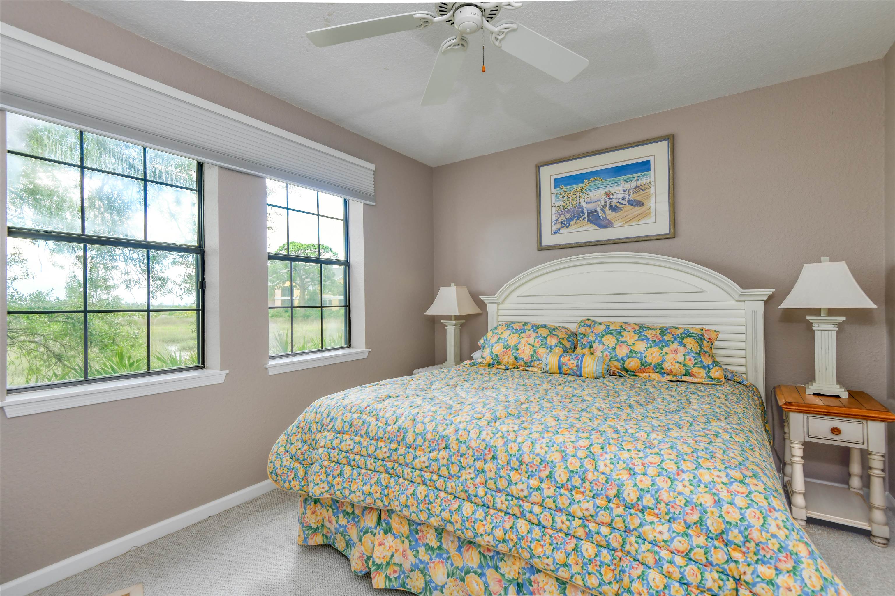 2202 Vista Cove Road St. Augustine, FL 32084 - Photo 11 of 38 a bedroom with a bed a rug and a window