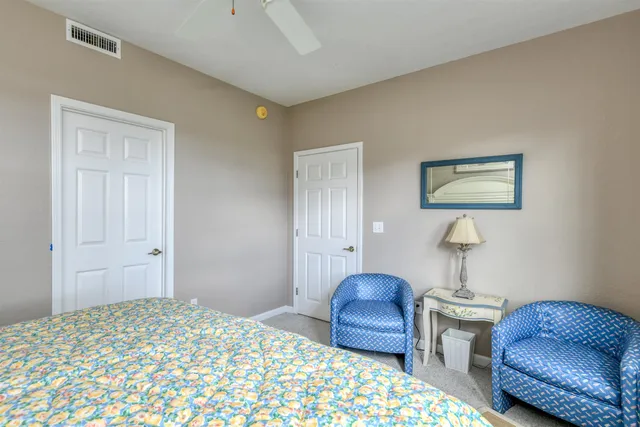 a bedroom with furniture and a window