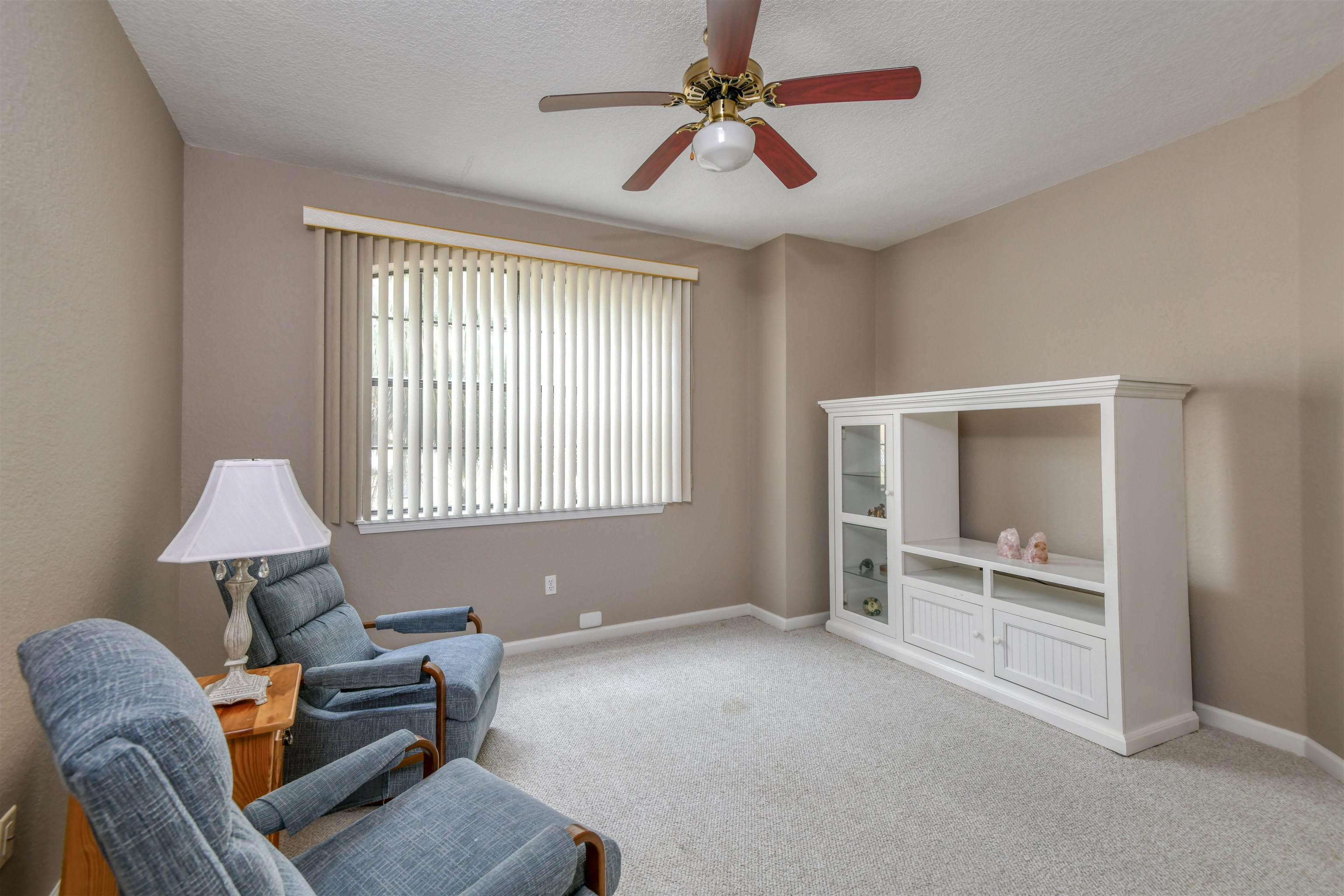 2202 Vista Cove Road St. Augustine, FL 32084 - Photo 18 of 38 a living room with furniture and a window