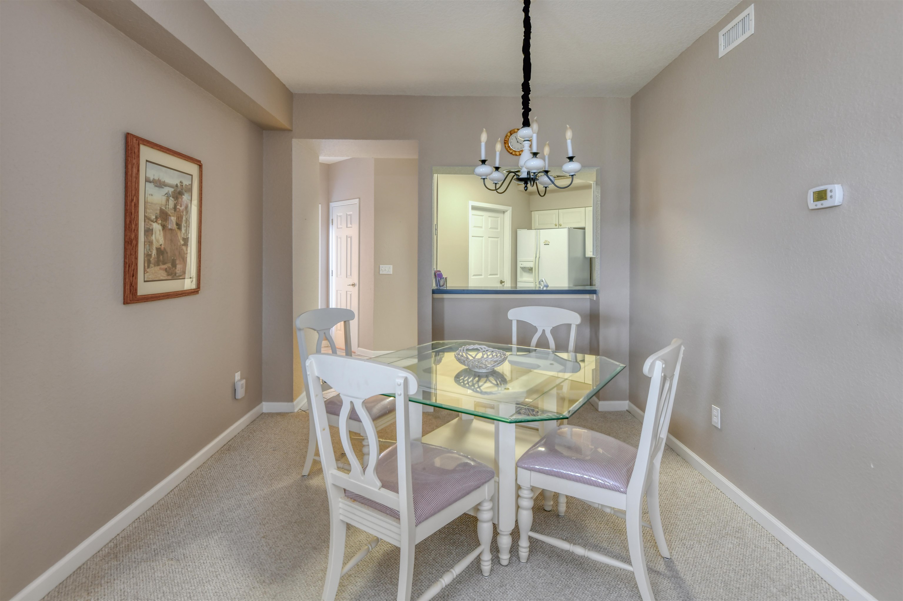 2202 Vista Cove Road St. Augustine, FL 32084 - Photo 20 of 38 a view of a dining room with furniture and chandelier