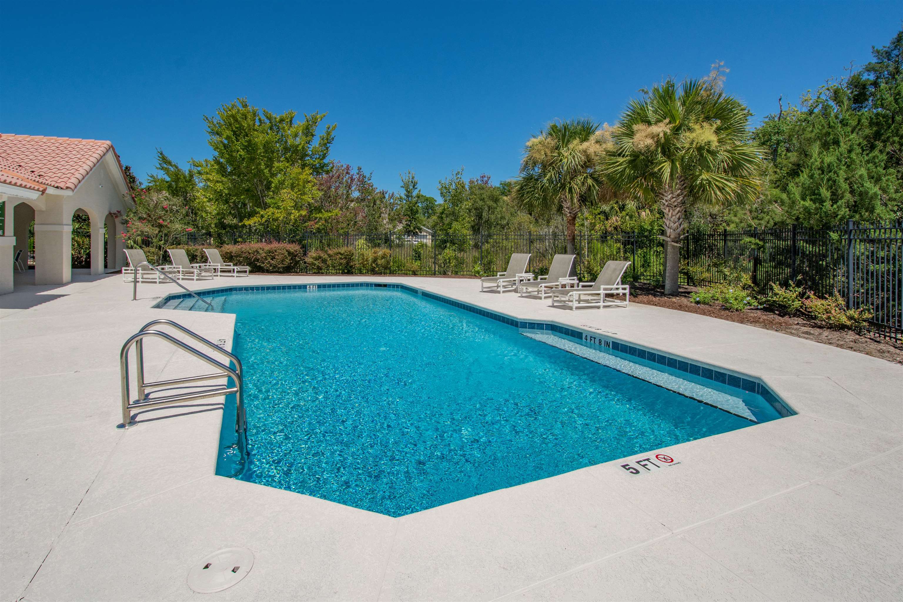 2202 Vista Cove Road St. Augustine, FL 32084 - Photo 26 of 38 a view of a swimming pool with a yard