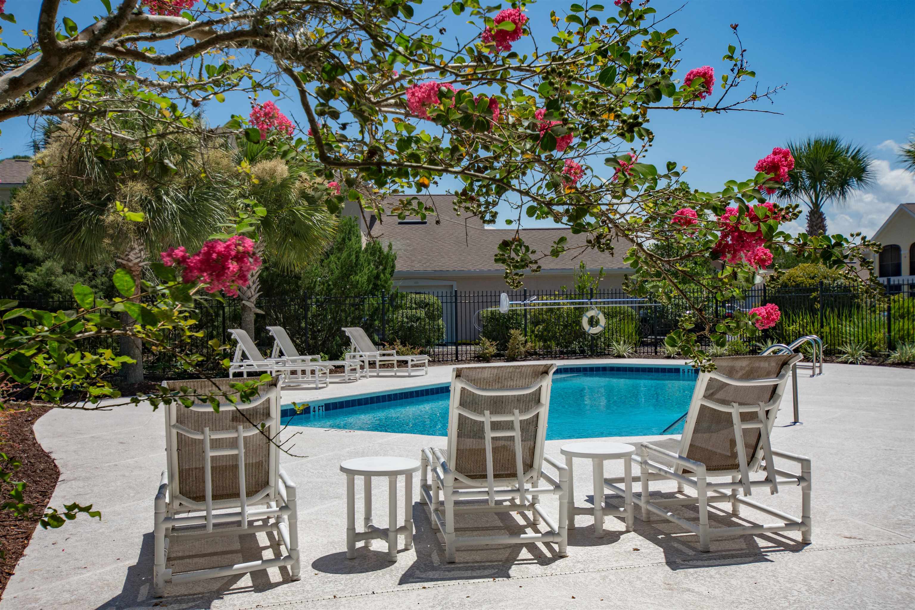 2202 Vista Cove Road St. Augustine, FL 32084 - Photo 28 of 38 a view of a chairs and table in a patio