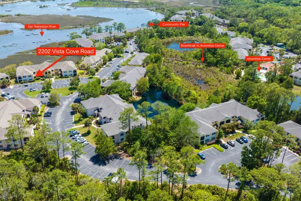 an aerial view of a houses with yard