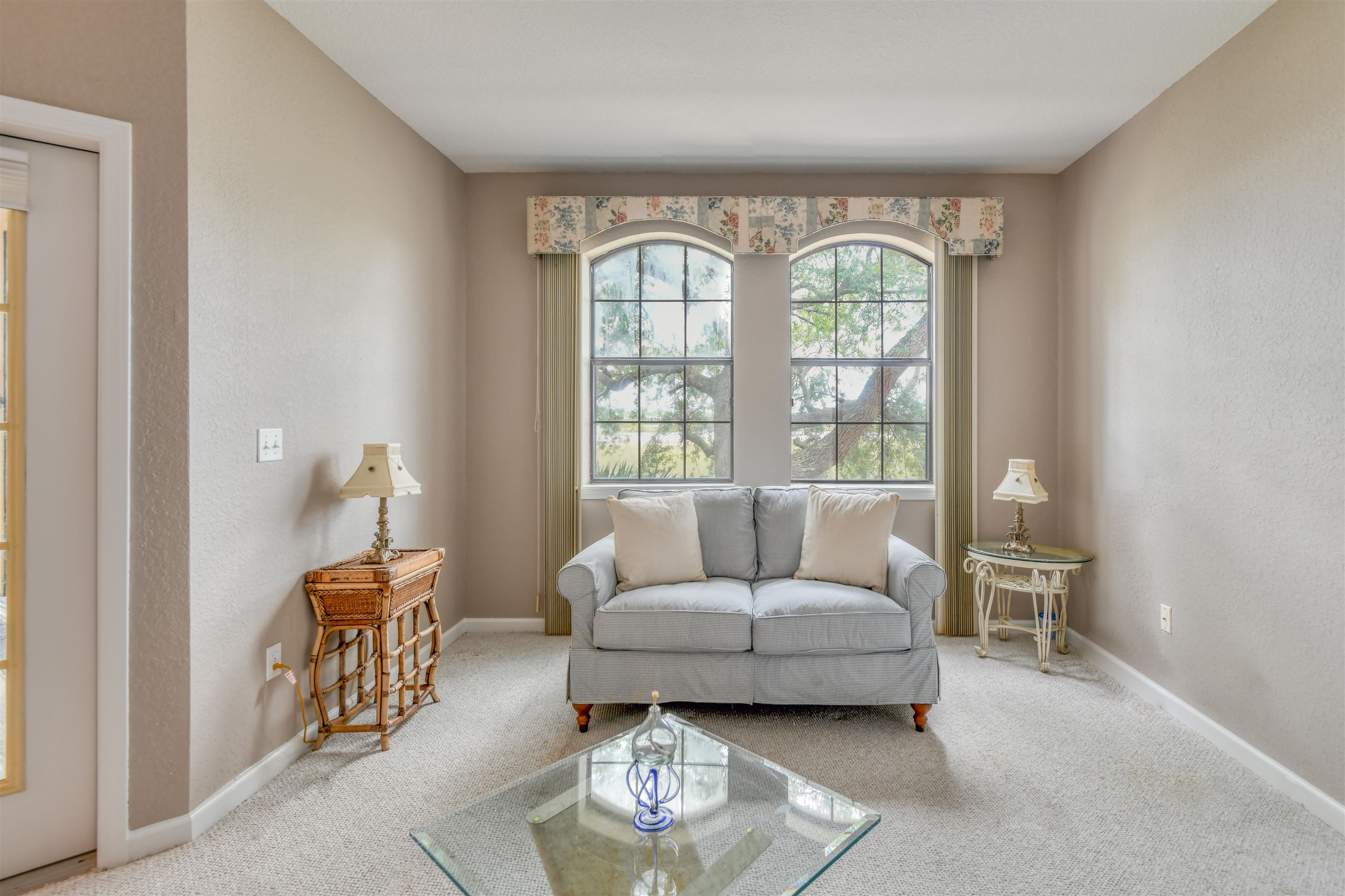 2202 Vista Cove Road St. Augustine, FL 32084 - Photo 5 of 38 a living room with furniture and a large window