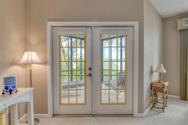 a view of empty room with furniture and a window