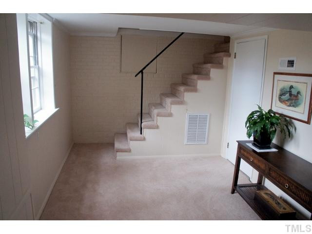 1301 Crabapple Lane Raleigh, NC 27607 - Photo 16 of 18 Office area in finished basement area. Utility room is through the door. Studio/Study/Office