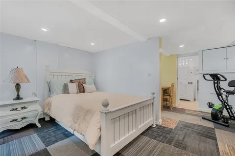 a kitchen with cabinets and chairs