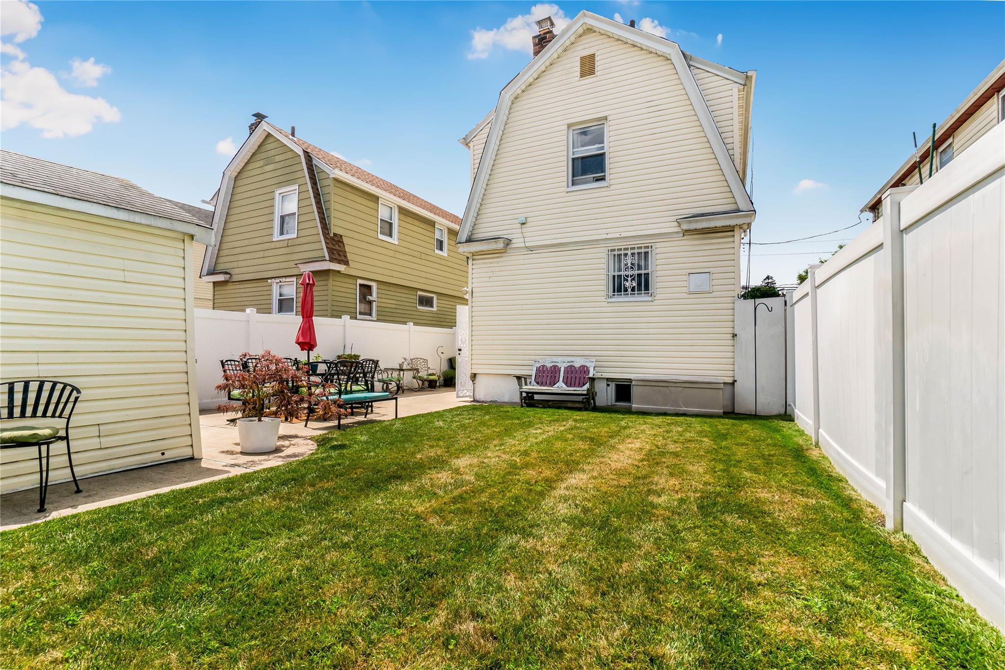 90-21 218th Place Queens, NY 11428 - Photo 16 of 21 a view of a house with backyard