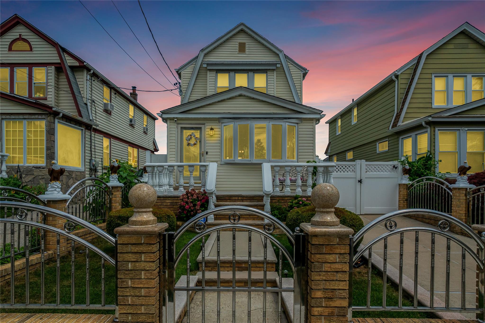 90-21 218th Place Queens, NY 11428 - Photo 17 of 21 a front view of multiple houses
