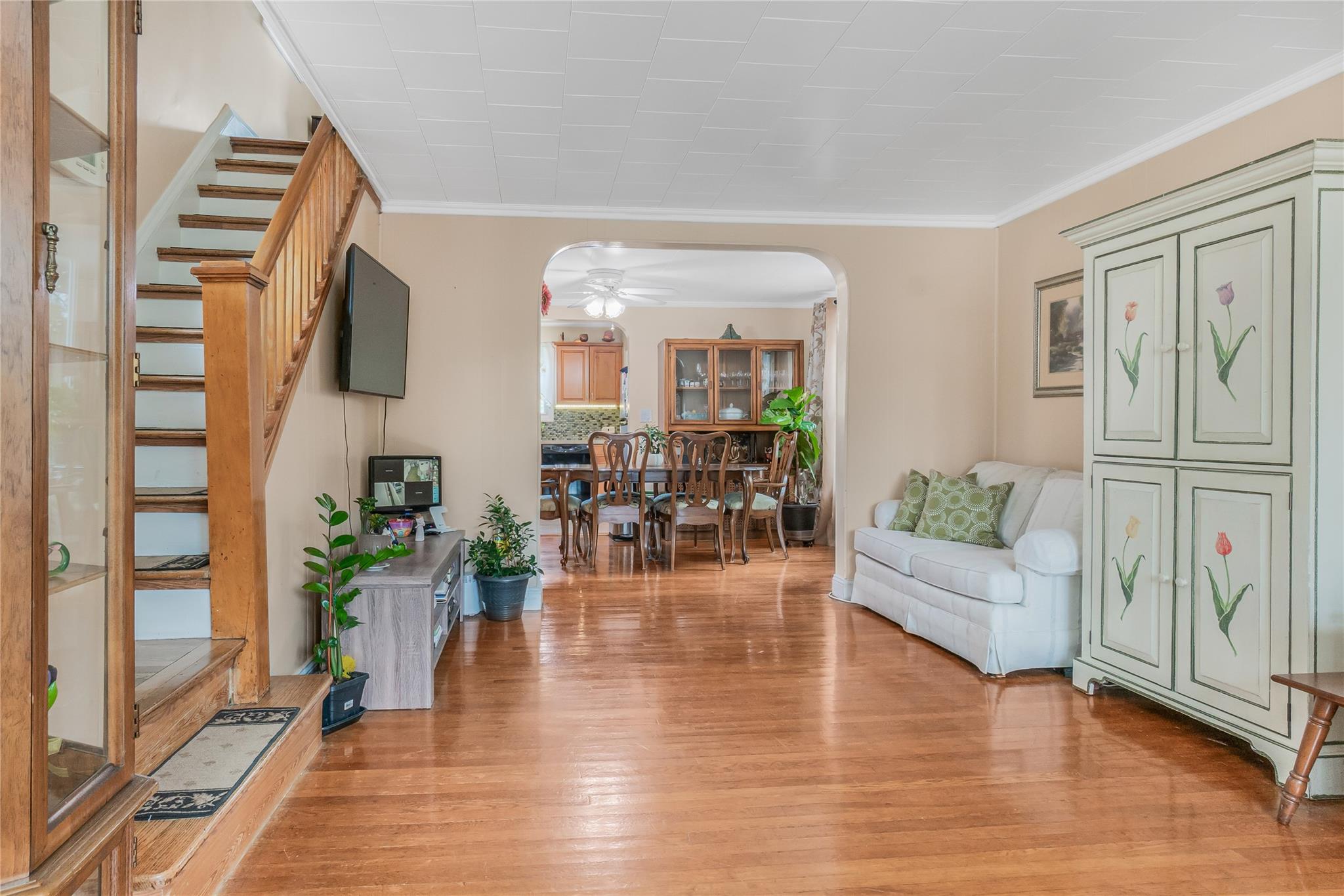 90-21 218th Place Queens, NY 11428 - Photo 2 of 21 a living room with furniture and wooden floor