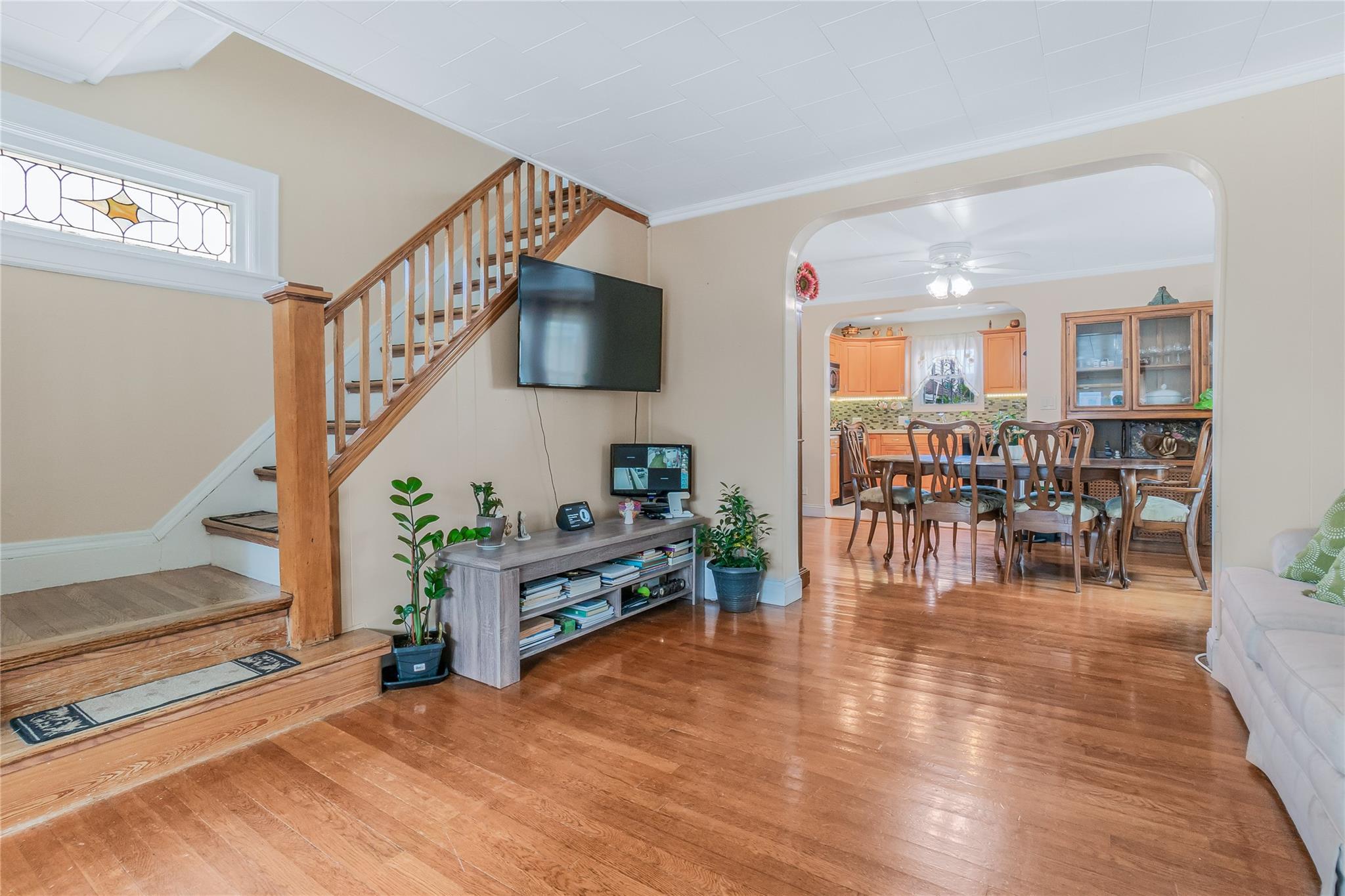 90-21 218th Place Queens, NY 11428 - Photo 7 of 21 a living room with furniture and a flat screen tv