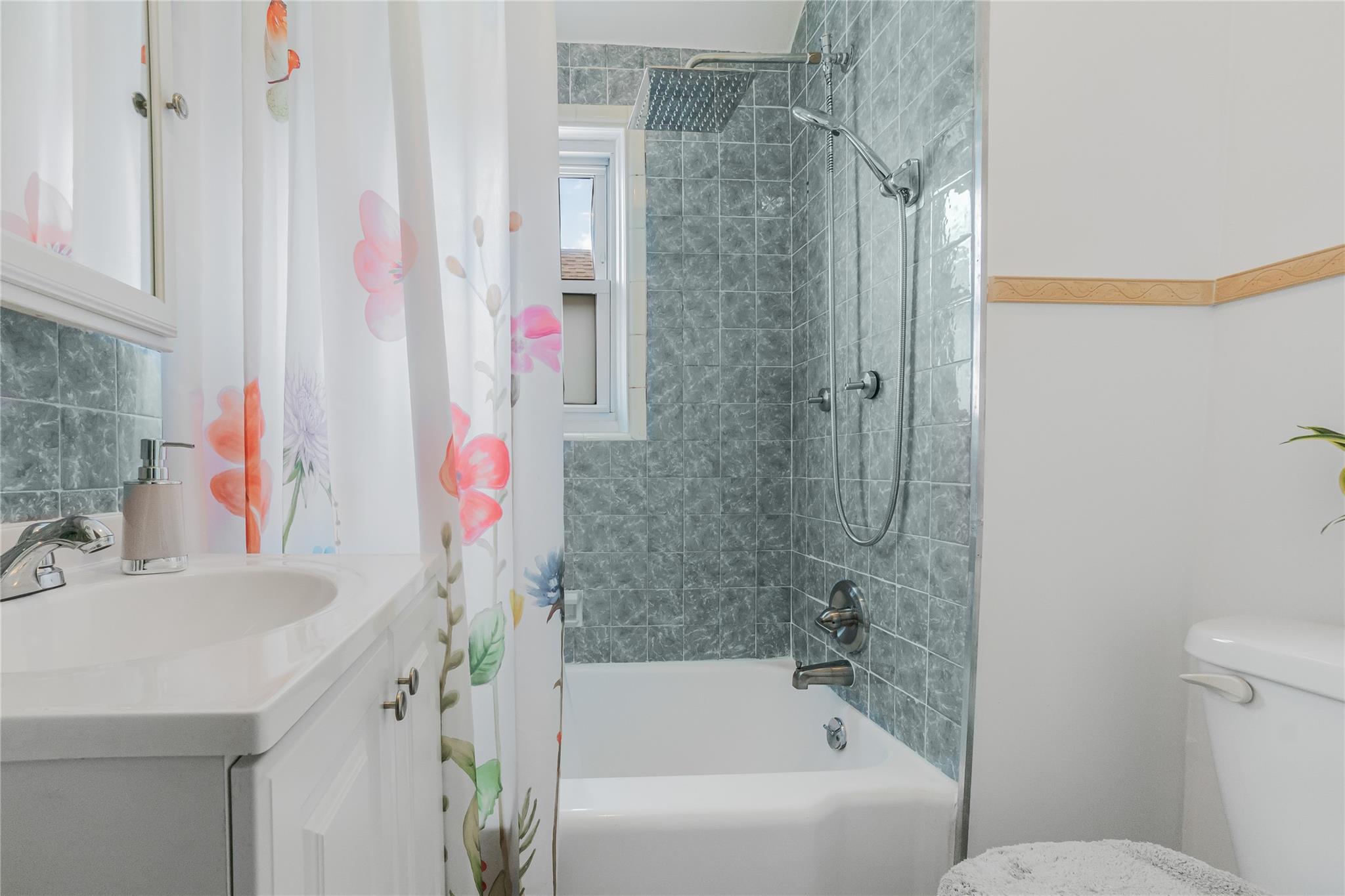 90-21 218th Place Queens, NY 11428 - Photo 10 of 21 a bathroom with a sink and a shower