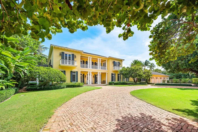 a kitchen with stainless steel appliances granite countertop a stove and a wooden floors