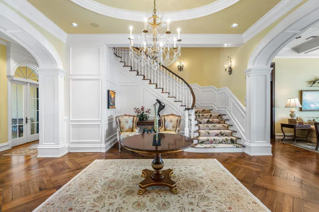 a kitchen with stainless steel appliances kitchen island granite countertop a stove a sink and a refrigerator