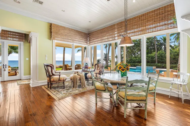 a view of a patio with a table and chairs