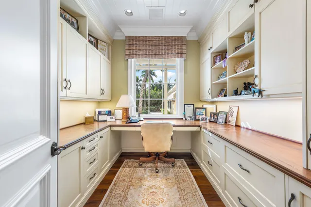 a front view of a house with a yard and swimming pool