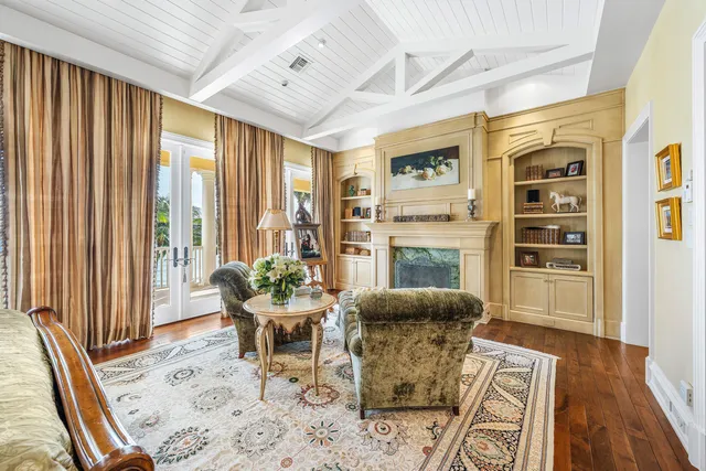 a view of house with swimming pool and trees in the background