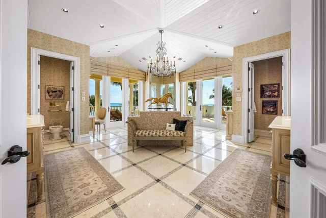 an aerial view of a house with swimming pool patio and lake view