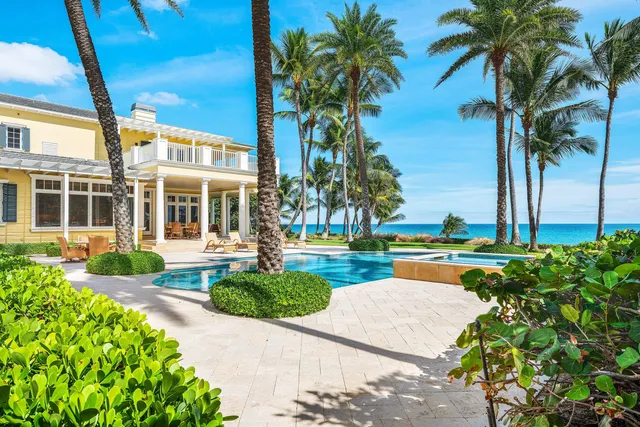a living room with furniture a wooden floor and next to a window