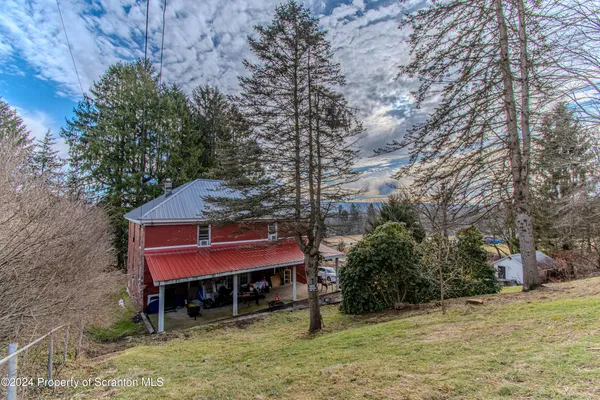 a wooden bench sitting in front of a building