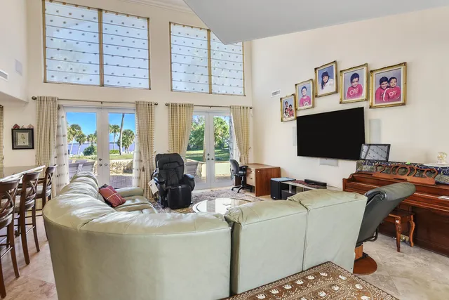 a living room with fireplace furniture and a flat screen tv