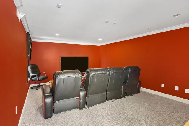 a bedroom with a bed and chair