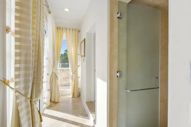 a view of a bathroom with a glass door