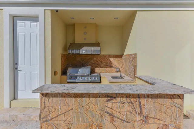 a view of a house with swimming pool and porch