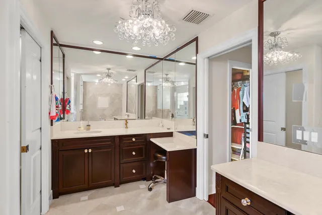 a bedroom that has a bed and a dresser in it