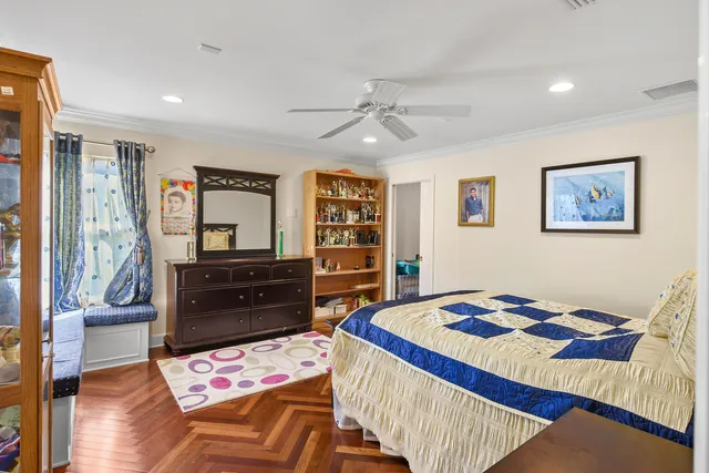 a bathroom with a granite countertop double vanity sink a large mirror and a window
