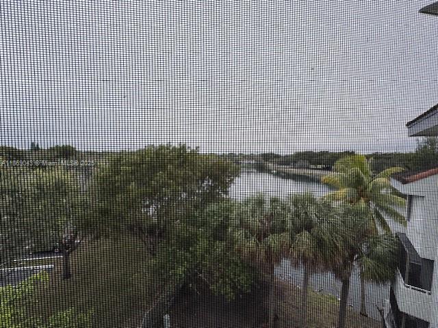 8335 Southwest 152nd Avenue, Unit PH2 Miami, FL 33193 - Photo 12 of 19 a view of residential houses with lake view