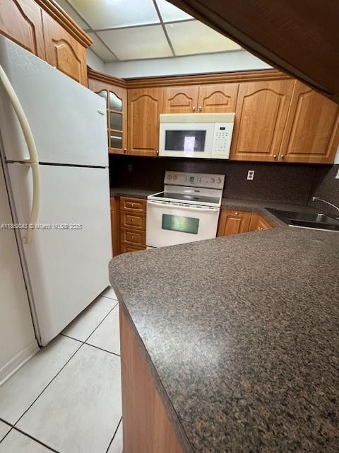 8335 Southwest 152nd Avenue, Unit PH2 Miami, FL 33193 - Photo 16 of 19 a kitchen with stainless steel appliances granite countertop a sink and a refrigerator