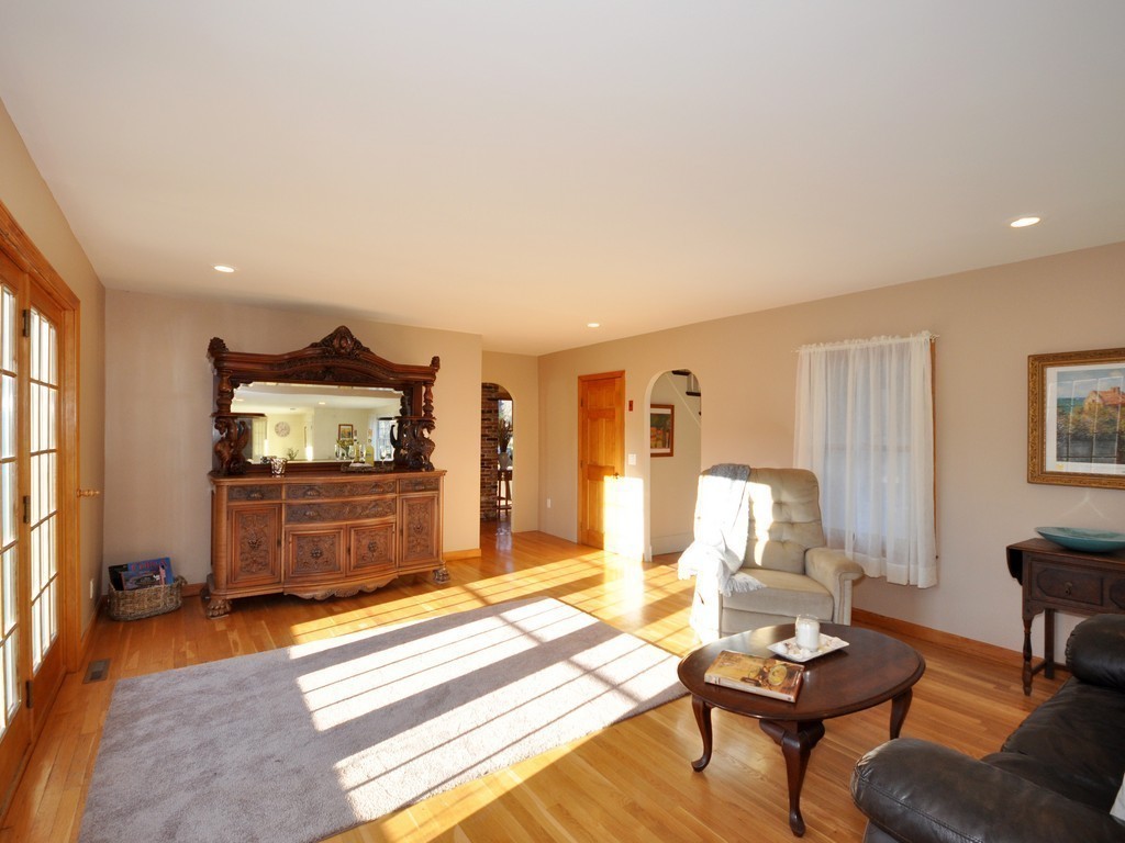 1024 Liberty Square Road Boxborough, MA 01719 - Photo 7 of 24 a living room with furniture and a flat screen tv