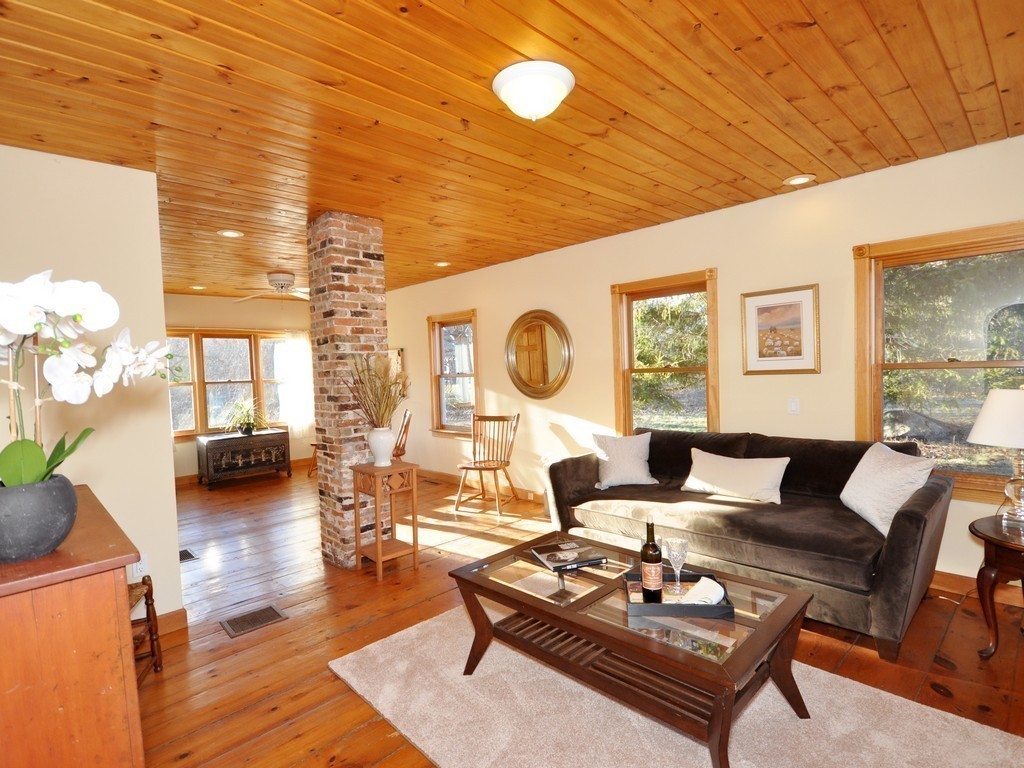 1024 Liberty Square Road Boxborough, MA 01719 - Photo 9 of 24 a living room with furniture a rug potted plant and a large window