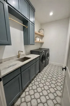 a kitchen with a sink and cabinets