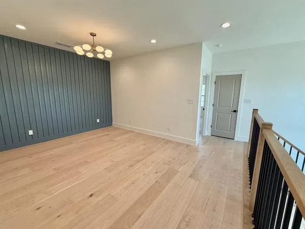 en empty room with wooden floor