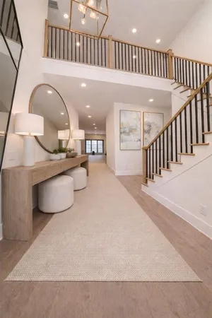 a view of a living room and entryway