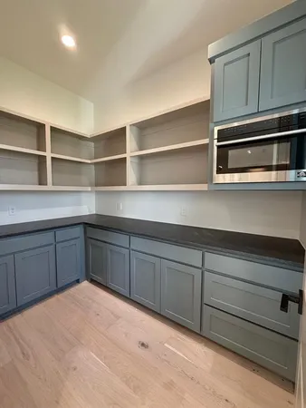 a kitchen with a oven and cabinets