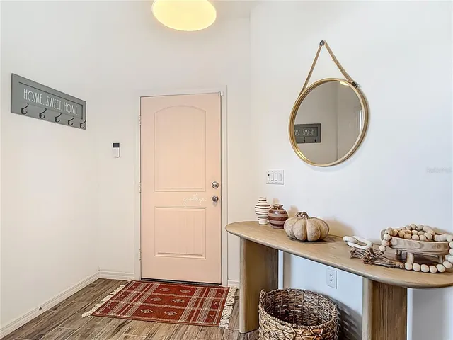 a room with a table and a mirror