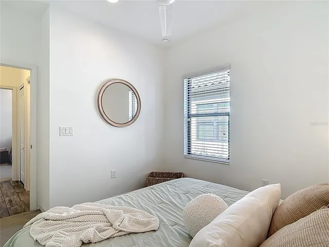 a spacious bathroom with a mirror and a sink