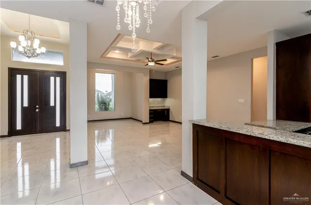 a view of an entryway door and hallway