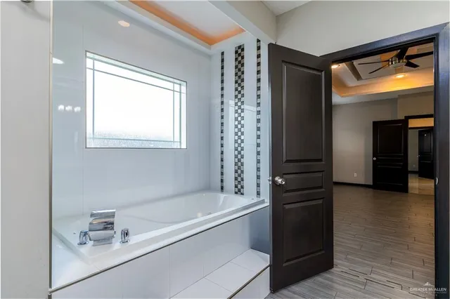 a bathroom with a bathtub and a sink